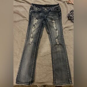 I am selling a pair of dark blue flared jean pants in a size 7/8R